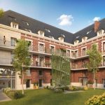 Immobilier Amiens avec ce programme Monument Historique et cette façade en pierre rouge